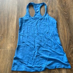 Size 8 blue racer back. Fitted Nulu material. Hip length